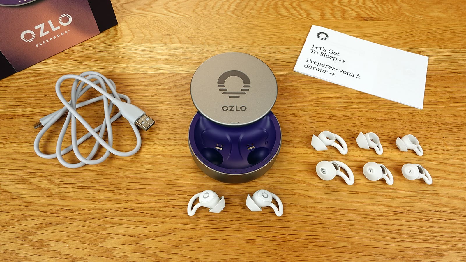 Ozlo Sleepbuds, carry case, spare tips, manual, charging cable, and box