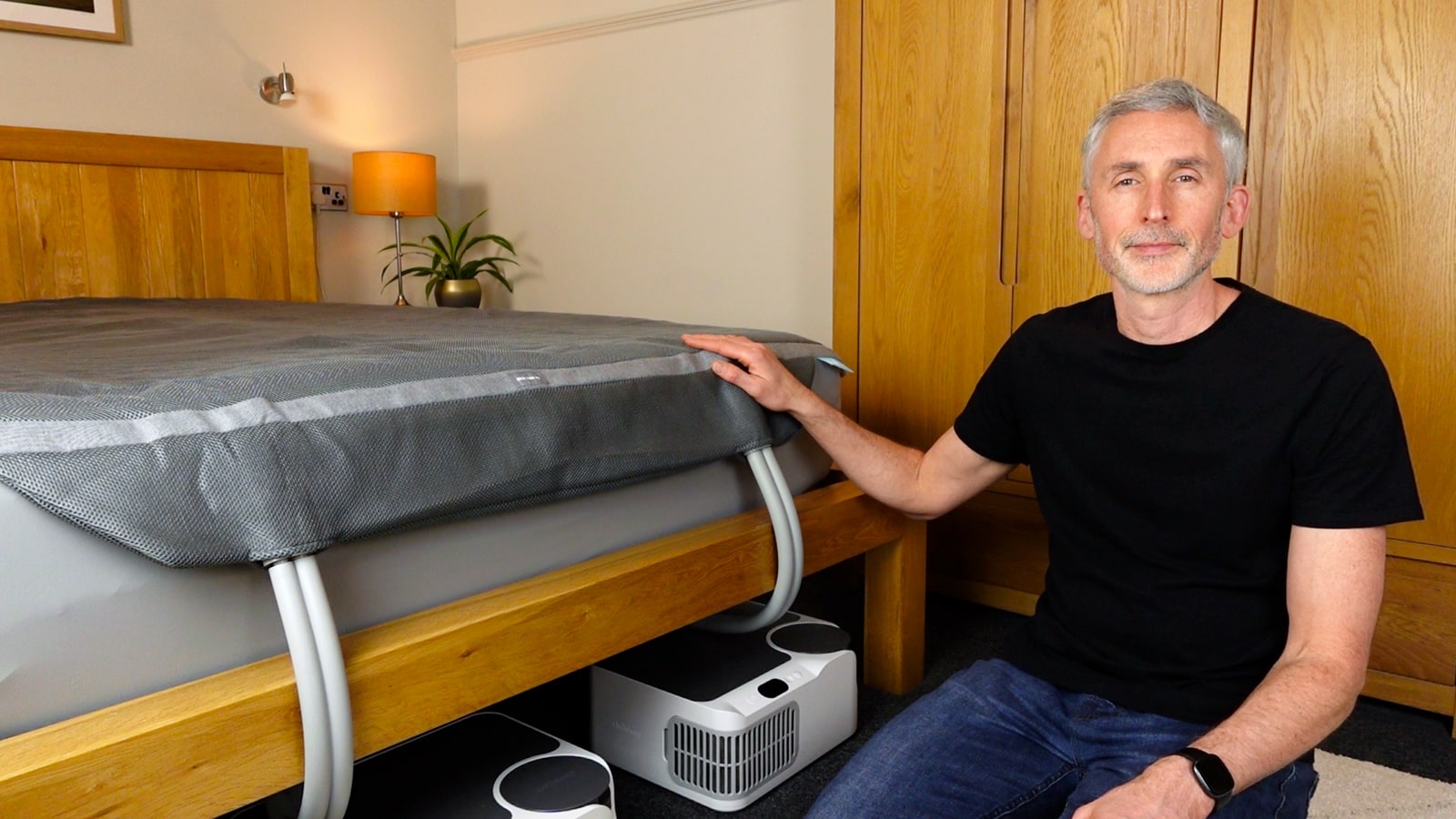 Man in a bedroom with the Chilipad Dock Pro
