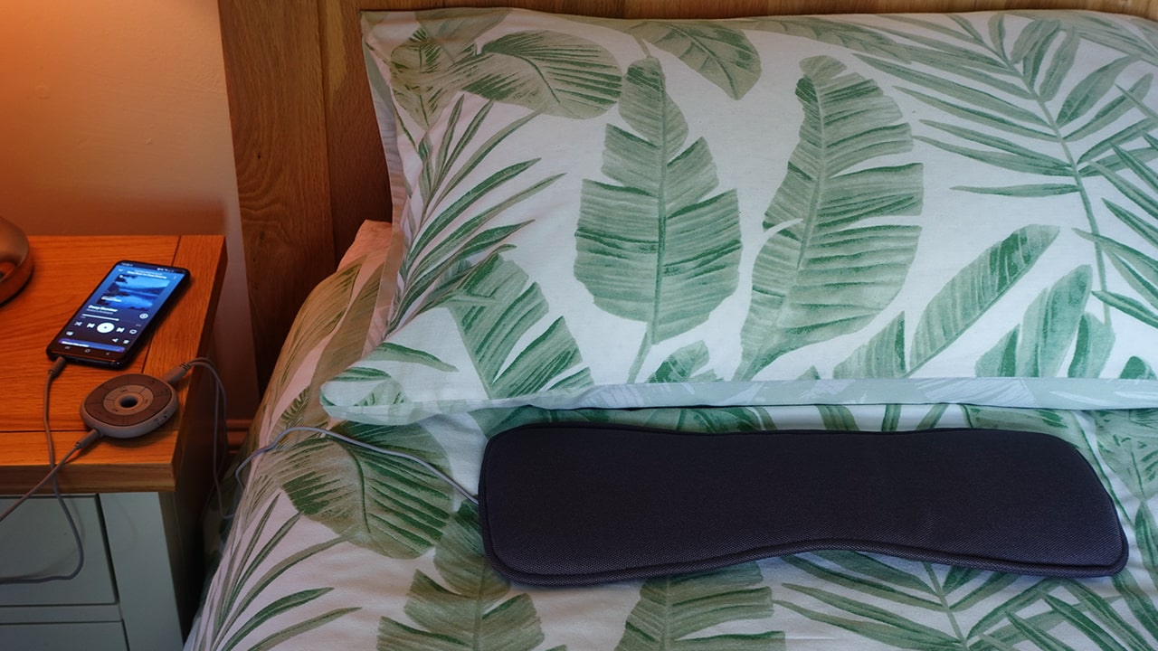 Avantree Slumber set up on a bed