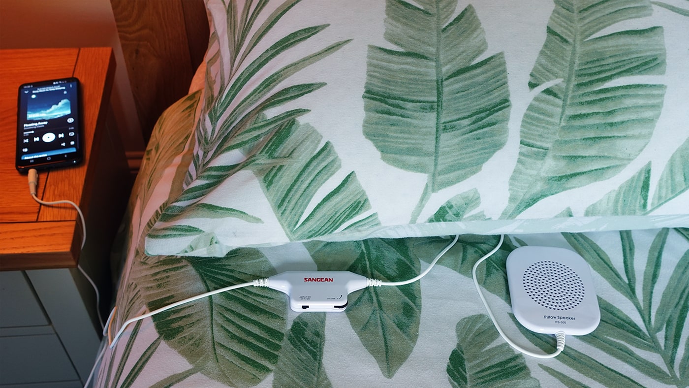 Sangean PS-300 Pillow Speaker set up on a bed
