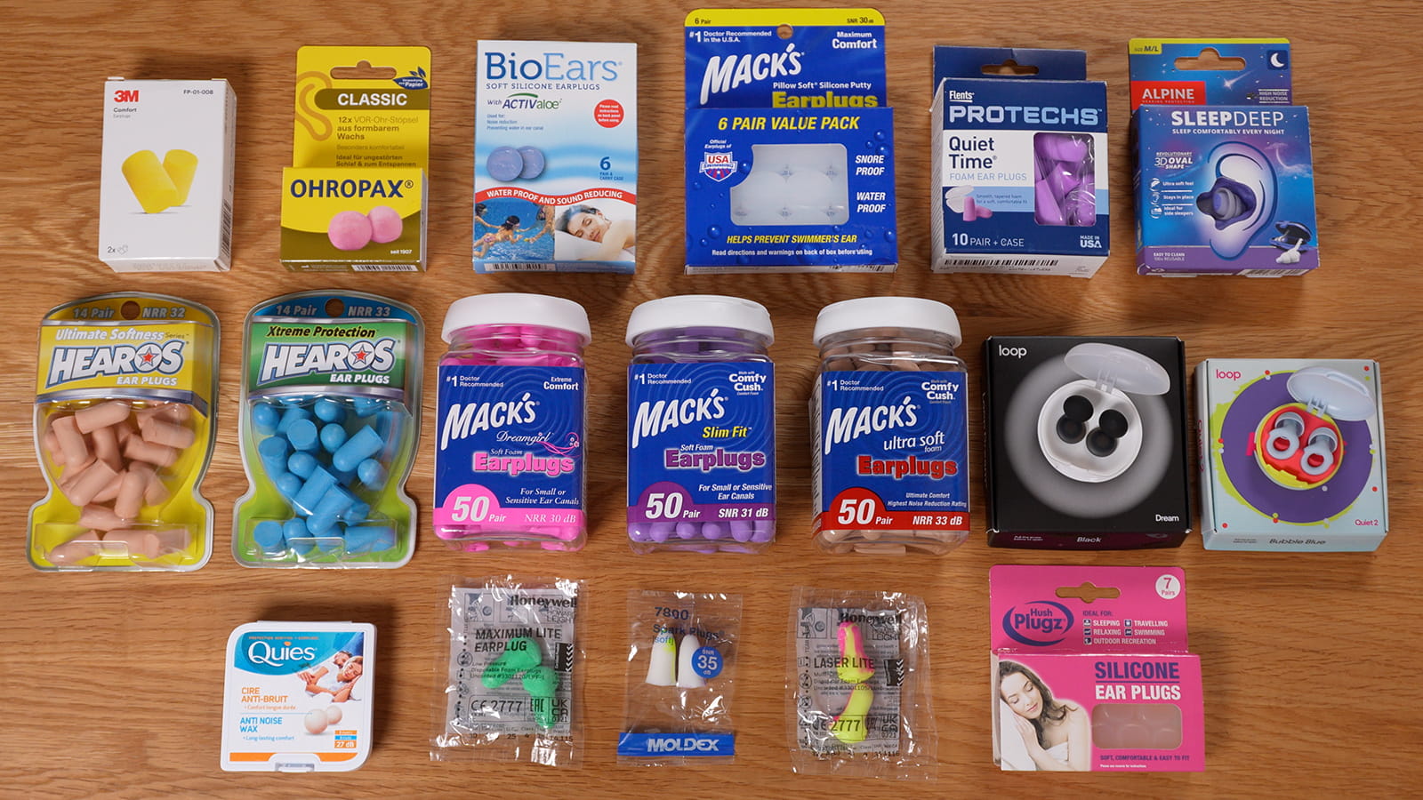 18 different earplugs in their boxes and packets