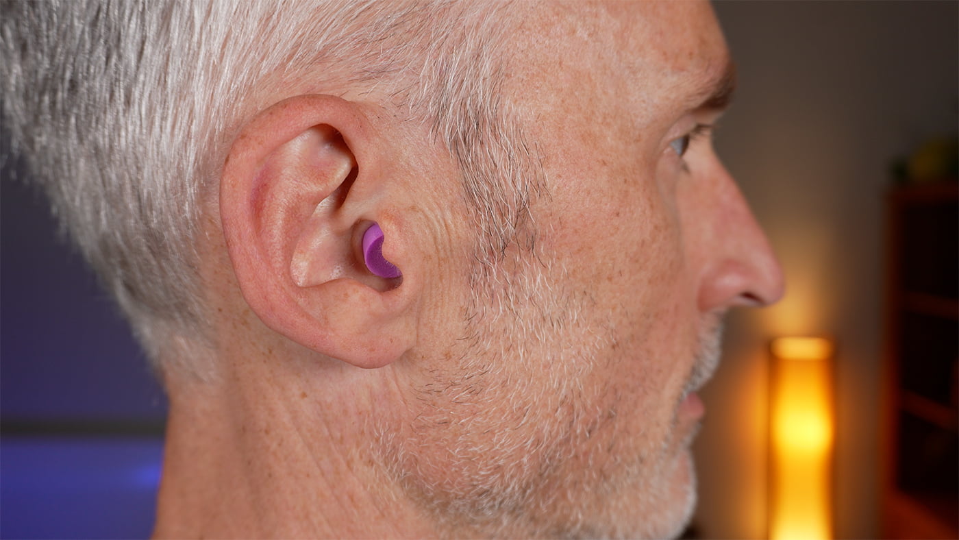 man wearing the Flents Protechs Quiet Time earplugs